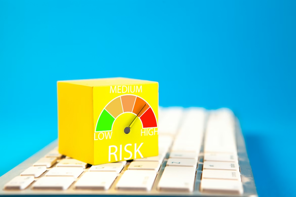 Yellow cube with risk meter sits on a keyboard